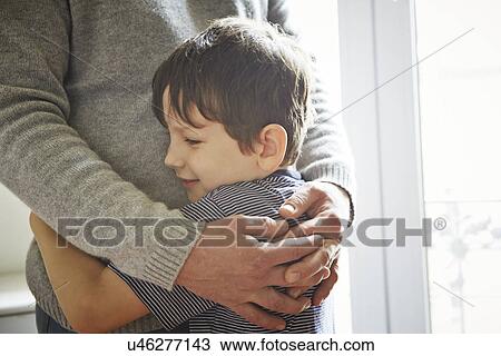 Father and son hugging View Large Photo Image Stock Image - Father and son hugging. Fotosearch