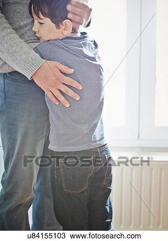 Father and son hugging View Large Photo Image Stock Image - Father and son hugging. Fotosearch