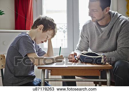 Father helping son with homework View Large Photo Image Stock Image - Father helping son with homework. Fotosearch