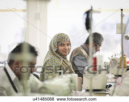 Female worker in garment factory, portrait View Large Photo Image Stock Photo - Female worker in garment factory, portrait. Fotosearch