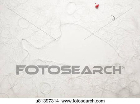 Fish with a fishhook and fishing line on white View Large Photo Image Picture - Fish with a fishhook and fishing line on white. Fotosearch