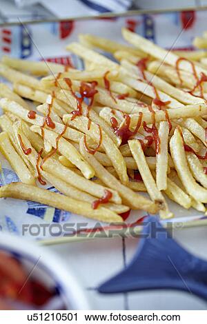 French fries with tomato ketchup View Large Photo Image Stock Image - French fries with tomato ketchup. Fotosearch