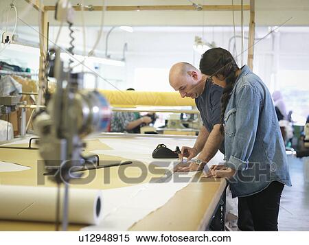 Garment workers training in clothing factory View Large Photo Image Stock Photography - Garment workers training in clothing factory. Fotosearch