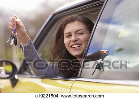 Girl holding car keys View Large Photo Image Picture - Girl holding car keys. Fotosearch