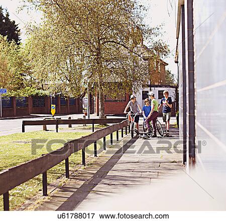 Stock Photo - Group of boys on pavement. Fotosearch