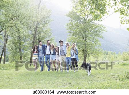 Picture - Group of eight young adult friends and their dog, Piemonte, Italy. Fotosearch