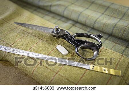 Harris tweed material and scissors in clothing factory View Large Photo Image Stock Image - Harris tweed material and scissors in clothing factory. Fotosearch