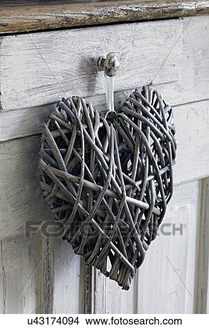 Heart shaped decoration, hanging on handle View Large Photo Image Picture - Heart shaped decoration, hanging on handle. Fotosearch