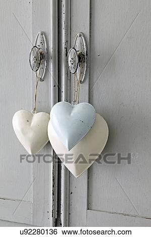 Heart shaped decoration, hanging on handle View Large Photo Image Stock Photograph - Heart shaped decoration, hanging on handle. Fotosearch