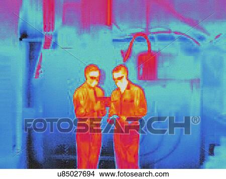 Picture - Infra red heat image of factory workers. Fotosearch