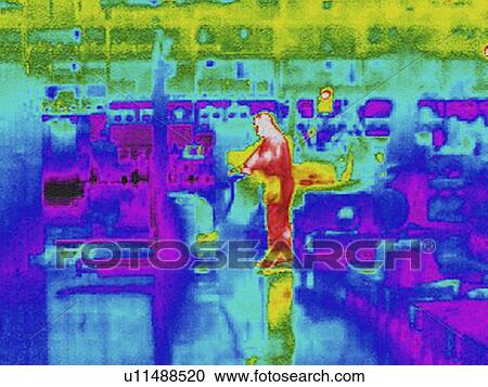Stock Image -  Infra red heat image of worker and heat loss at work station in factory. Fotosearch