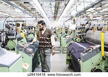 Male factory worker monitoring weaving machine quality in woollen mill View Large Photo Image Stock Photo - Male factory worker monitoring weaving machine quality in woollen mill. Fotosearch