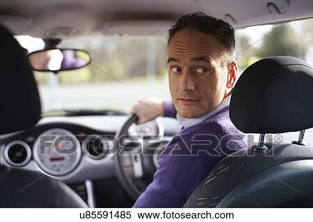 Man behind wheel of car View Large Photo Image Stock Photography - Man behind wheel of car. Fotosearch