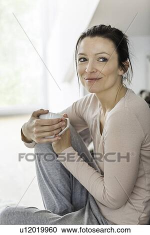 Mid adult woman with coffee View Large Photo Image Stock Image - Mid adult woman with coffee. Fotosearch