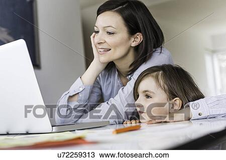Mother and daughter using laptop View Large Photo Image Stock Image - Mother and daughter using laptop. Fotosearch