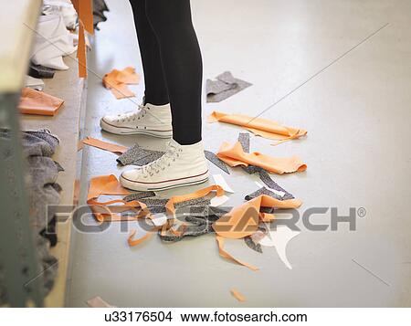 Off-cut material on floor in fashion design studio View Large Photo Image Picture - Off-cut material on floor in fashion design studio. Fotosearch