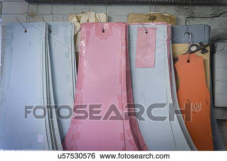 Stock Photograph - Patterns hanging in clothing factory. Fotosearch