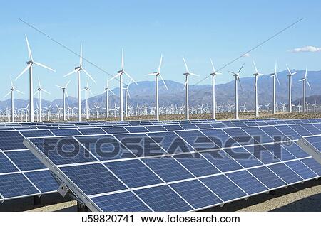 Stock Image - Photovoltaic solar panels and wind turbines, San Gorgonio Pass Wind Farm, Palm Springs, California, USA. This solar installation has a 2. 3 MW capacity. Fotosearch
