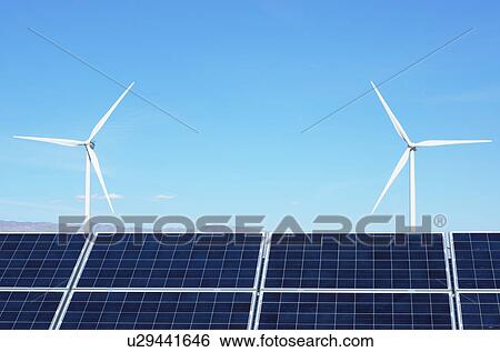 Stock Photograph - Photovoltaic solar panels and wind turbines, San Gorgonio Pass Wind Farm, Palm Springs, California, USA. Fotosearch
