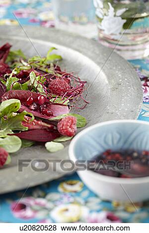 Stock Photo - Plate of salad and berries. Fotosearch