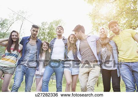 Portrait of a group of eight young adult friends View Large Photo Image Stock Photograph - Portrait of a group of eight young adult friends. Fotosearch