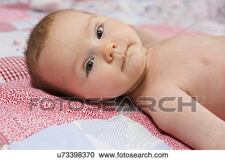 Portrait of contented 7 month old baby girl in crib View Large Photo Image Stock Image - Portrait of contented 7 month old baby girl in crib. Fotosearch