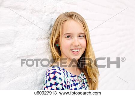 Portrait of girl next to white wall View Large Photo Image Stock Image - Portrait of girl next to white wall. Fotosearch