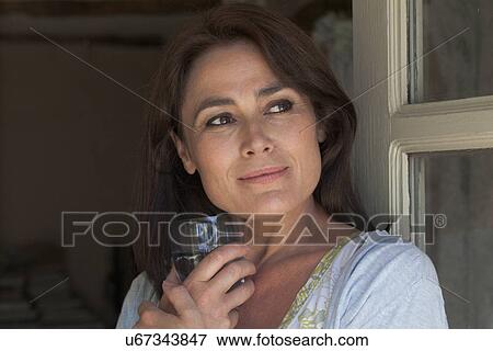 Portrait of mature adult woman with drinking glass View Large Photo Image Stock Photo - Portrait of mature adult woman with drinking glass. Fotosearch