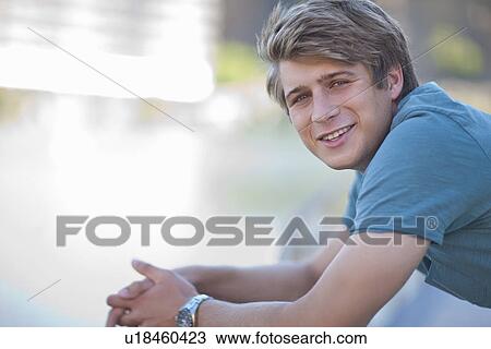 Stock Image - Portrait of relaxed young man. Fotosearch