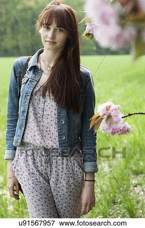 Portrait of serious young woman in field View Large Photo Image Stock Photo - Portrait of serious young woman in field. Fotosearch
