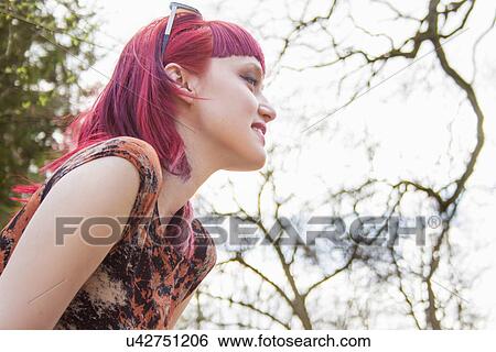 Portrait of smiling young woman with pink hair View Large Photo Image Stock Photograph - Portrait of smiling young woman with pink hair. Fotosearch