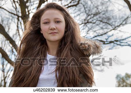 Stock Photo - Portrait of teenage girl in parka jacket. Fotosearch