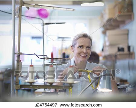 Portrait of worker in clothing factory View Large Photo Image Stock Photo - Portrait of worker in clothing factory. Fotosearch