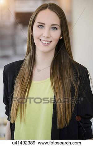 Stock Photo - Portrait of young businesswoman in cafe. Fotosearch