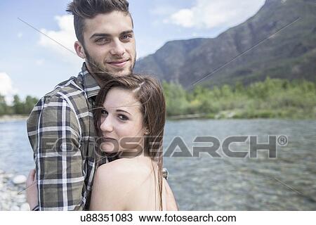 Portrait of young couple on Toce riverbank, Piemonte, Italy View Large Photo Image Stock Image - Portrait of young couple on Toce riverbank, Piemonte, Italy. Fotosearch