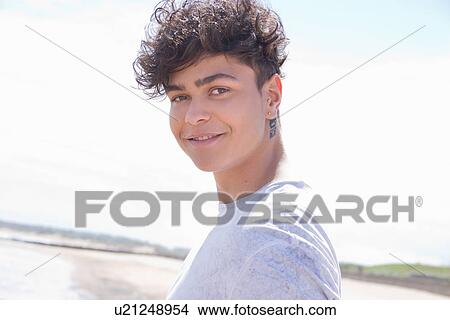 Portrait of young man at beach View Large Photo Image Picture - Portrait of young man at beach. Fotosearch
