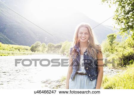 Stock Photo - Portrait of young woman on Toce riverbank, Piemonte, Italy. Fotosearch