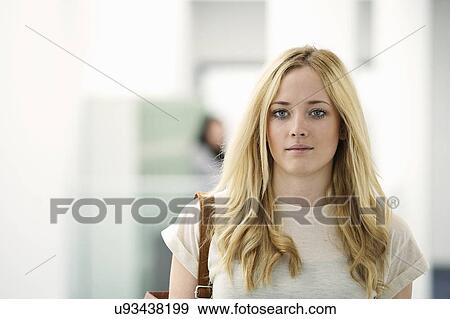 Portrait of young woman with long blonde hair View Large Photo Image Stock Photo - Portrait of young woman with long blonde hair. Fotosearch