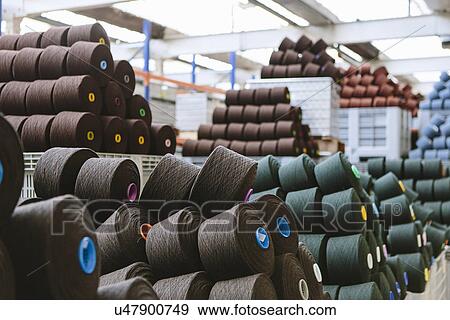 Stock Photo - Reels of wool in storage room in woollen mill. Fotosearch