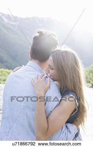 Romantic young couple on riverbank View Large Photo Image Stock Image - Romantic young couple on riverbank. Fotosearch