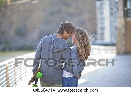 Picture - Romantic young couple on waterfront. Fotosearch
