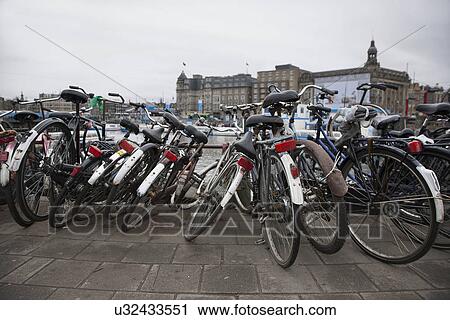 Stock Image - Rows of parked bicycles, Amsterdam, Netherlands. Fotosearch
