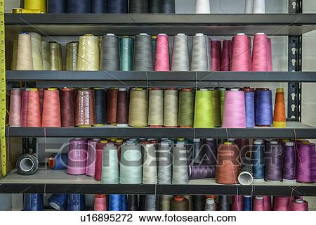 Shelves of coloured threads in fashion studio View Large Photo Image Stock Image - Shelves of coloured threads in fashion studio. Fotosearch