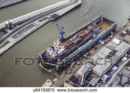 Stock Photography - Ship being built in a dry dock. Fotosearch