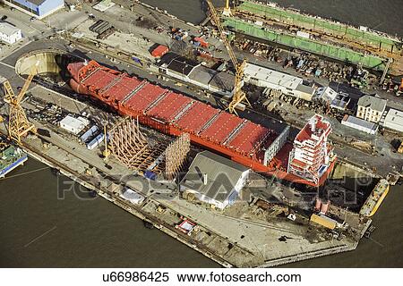Ship being built in a dry dock View Large Photo Image Stock Photography - Ship being built in a dry dock. Fotosearch