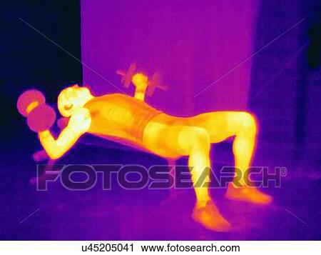 Stock Image - Side view thermal image of young male athlete training with barbells. The image shows the heat produced by the muscles. Fotosearch