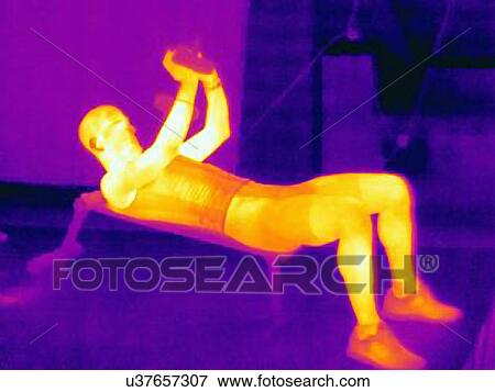 Side view thermal image of young man training with barbells. The image shows the heat produced by the muscles View Large Photo Image Stock Photo - Side view thermal image of young man training with barbells. The image shows the heat produced by the muscles. Fotosearch