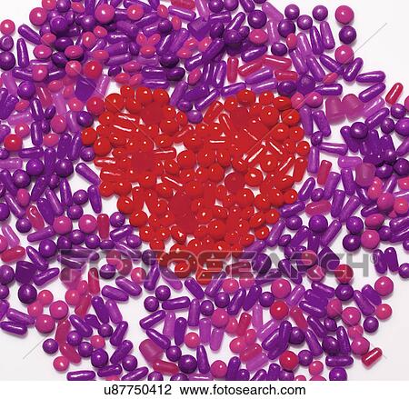 Still life of heart shaped by red candy View Large Photo Image Stock Image - Still life of heart shaped by red candy. Fotosearch