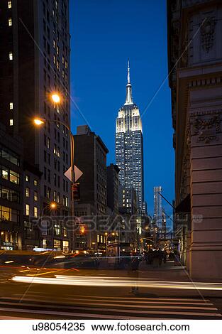 Stock Photography - Street view of New York with Empire State Building in view. Fotosearch
