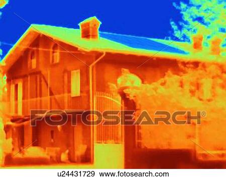 Stock Photo - Thermal image of a house with solar cells on the roof. Absorbing the light energy, the solar panel appears cold in the image. Fotosearch